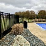 black aluminum fence around pool